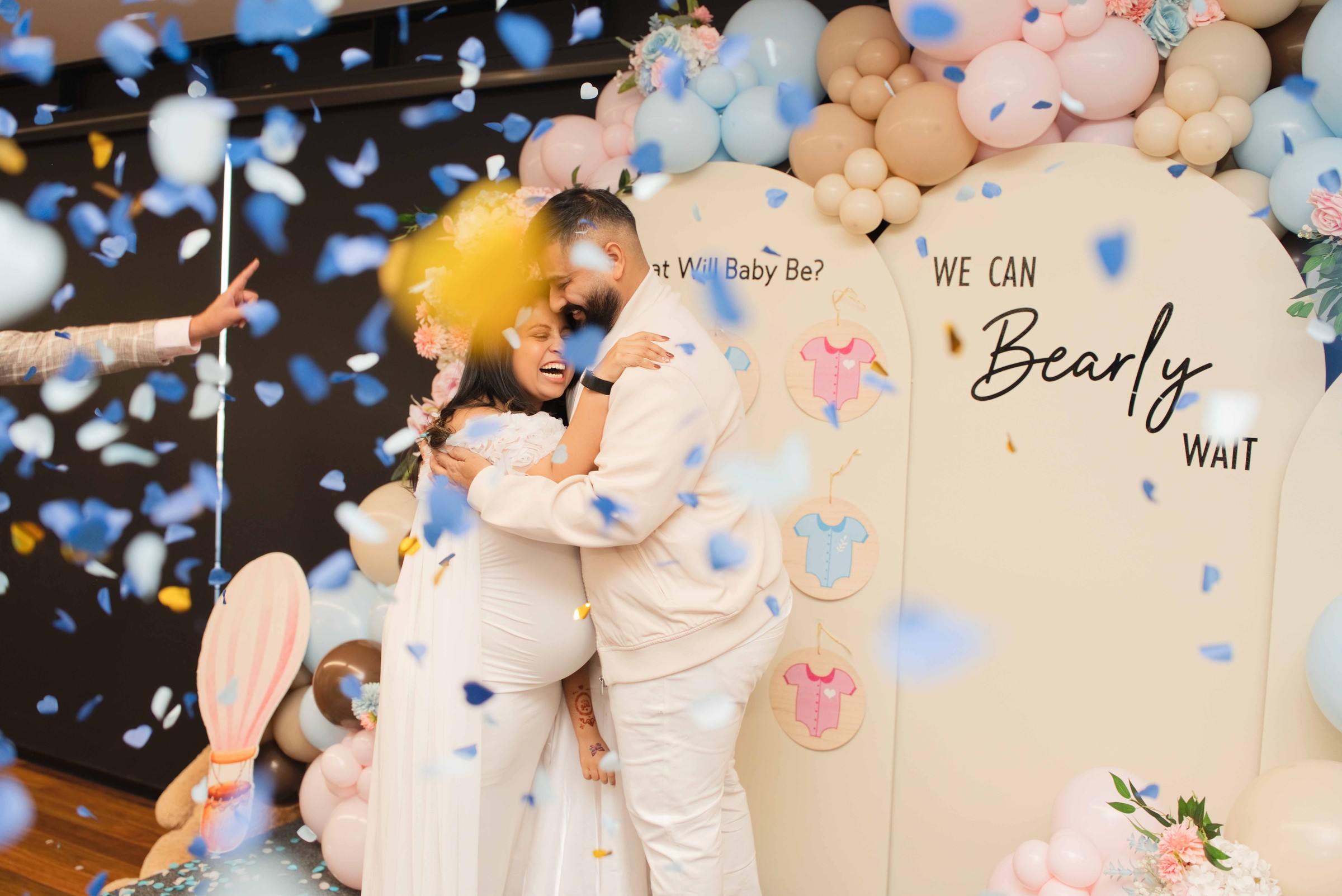 Honey and Tarak embracing and celebrating the news amid falling confetti